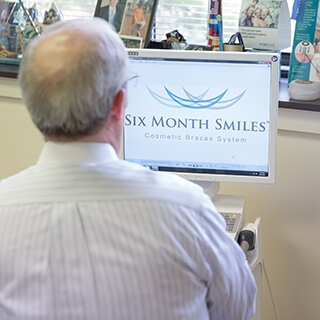 Dr. Mitchell using Six Month Smiles design software